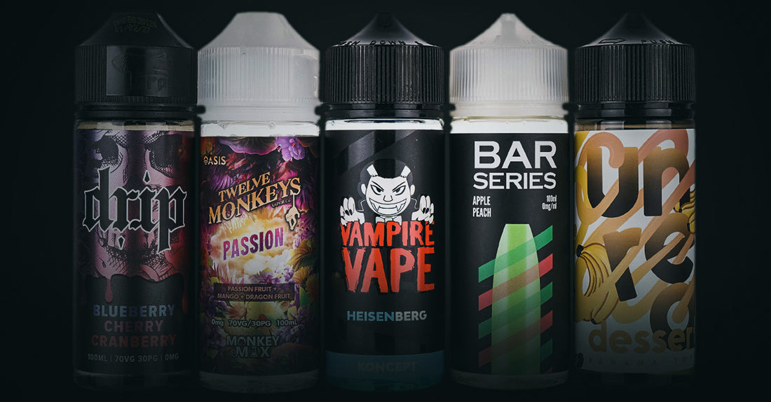Five vape juice bottles with various colorful labels on a dark background.