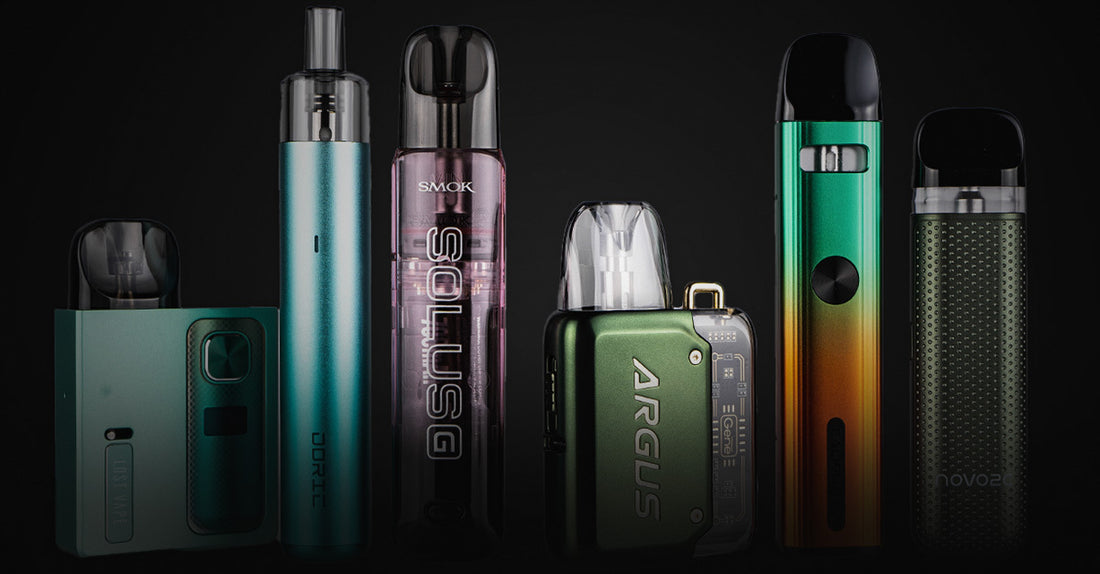 Various vape devices arranged against a dark background.