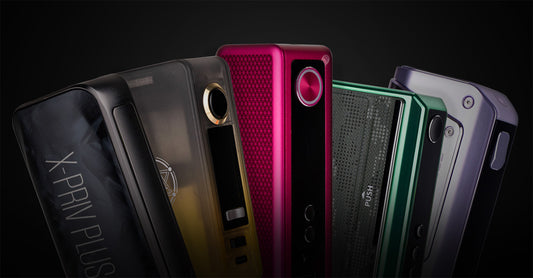 Various colorful vape devices arranged against a dark background.